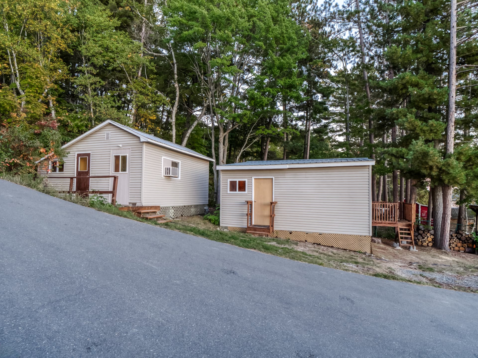 Two sleep cabins beside the driveway in the trees at 103A North Shore Road