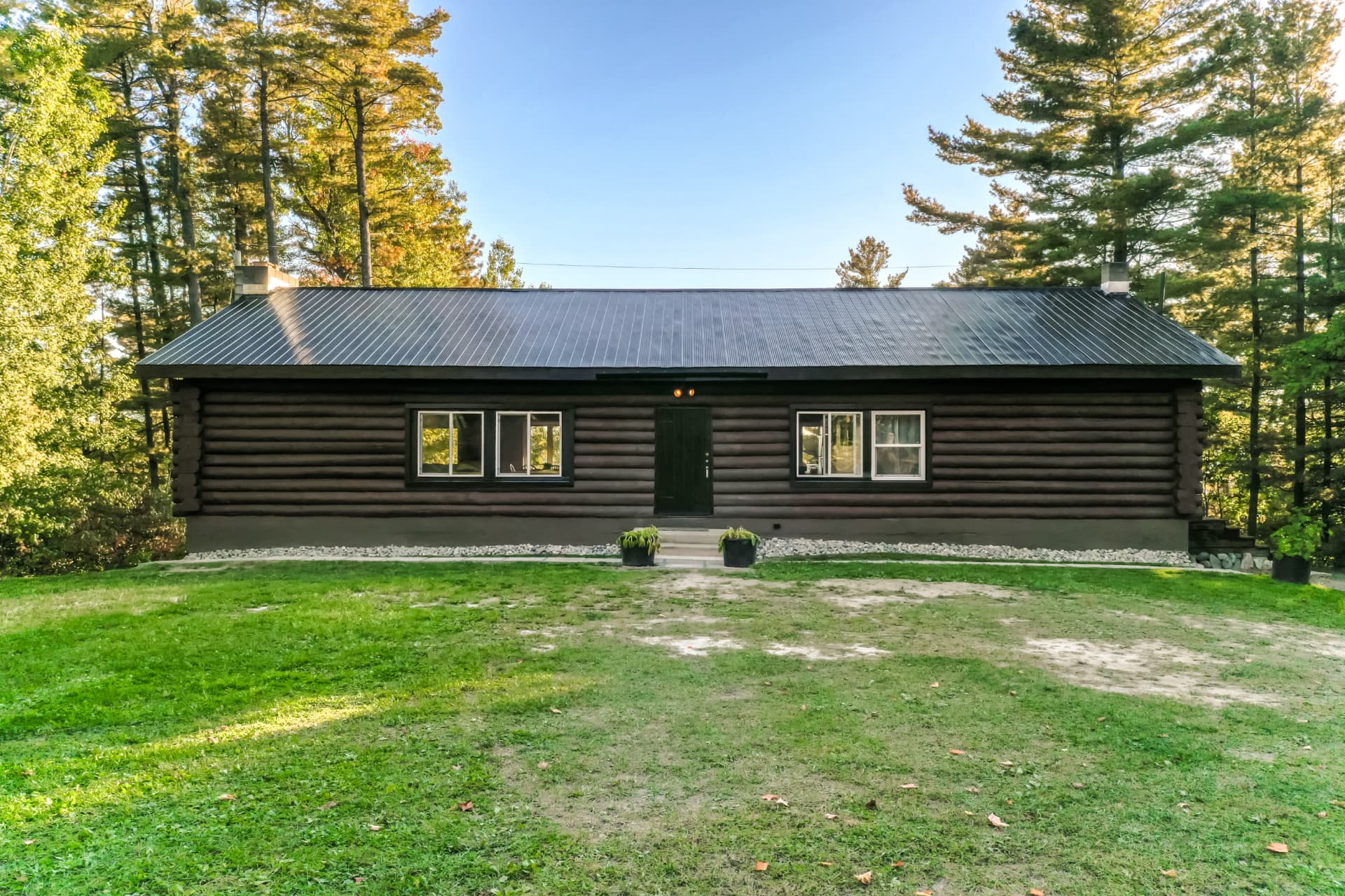 Front exterior of the log home at 103A North Shore Road