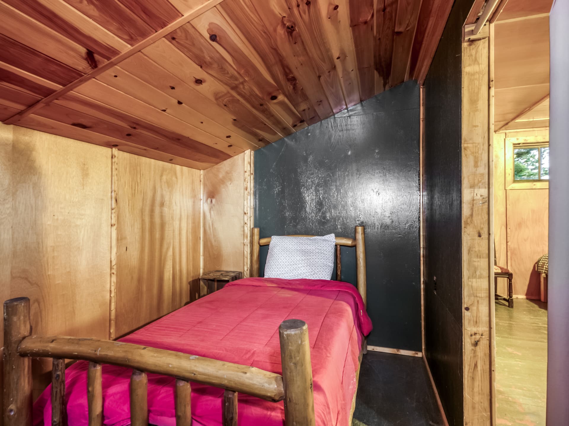 Rustic cabin room with a single bed